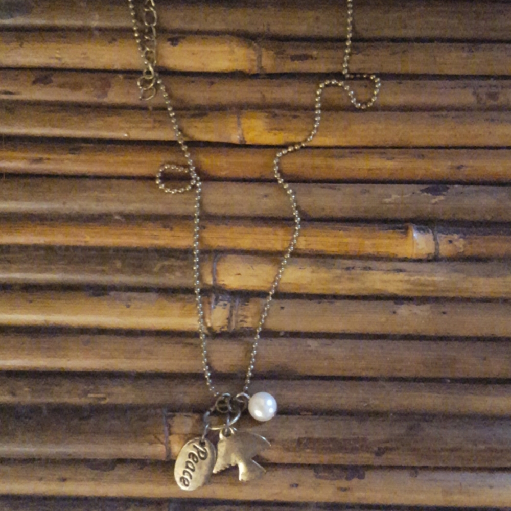 NWOT dark gold peace necklace